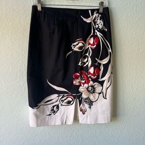 Black and white pencil skirt with red and tan flower design. Size 2